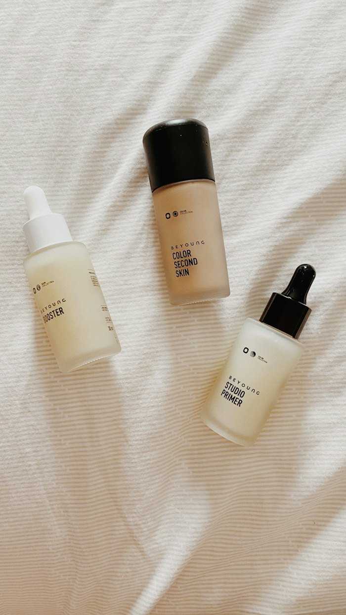Skincare serum bottles on soft linen
